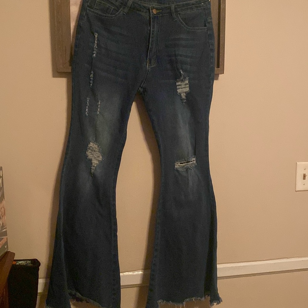 Flare distressed stretchy blue jeans
